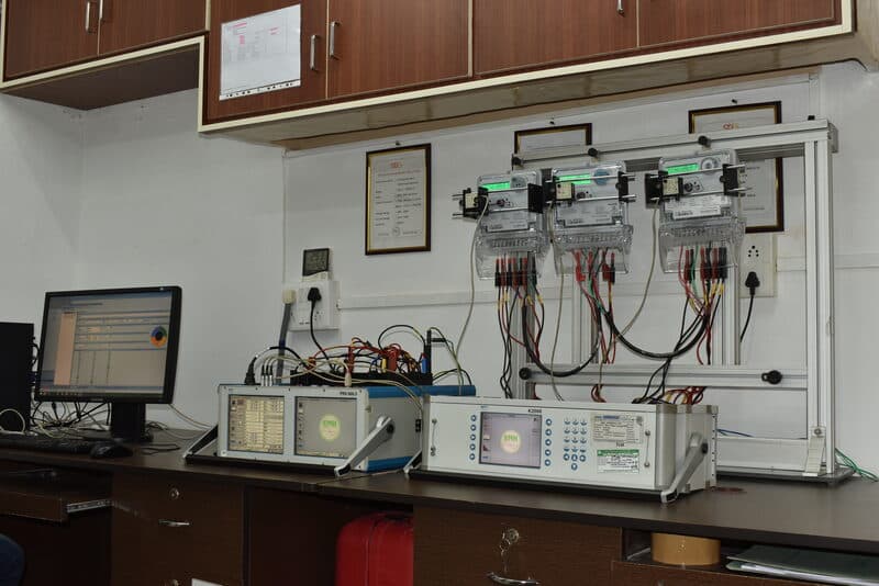 Energy meter test rig with K2006 reference standard and NABL accreditation certificates at SDES calibration lab