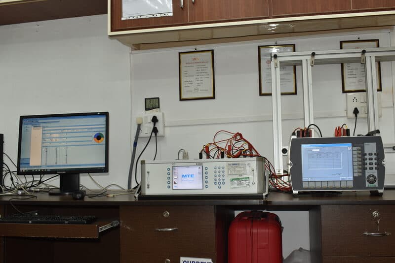 MTE K2006 energy meter reference standard with monitor displaying calibration readings at SDES lab