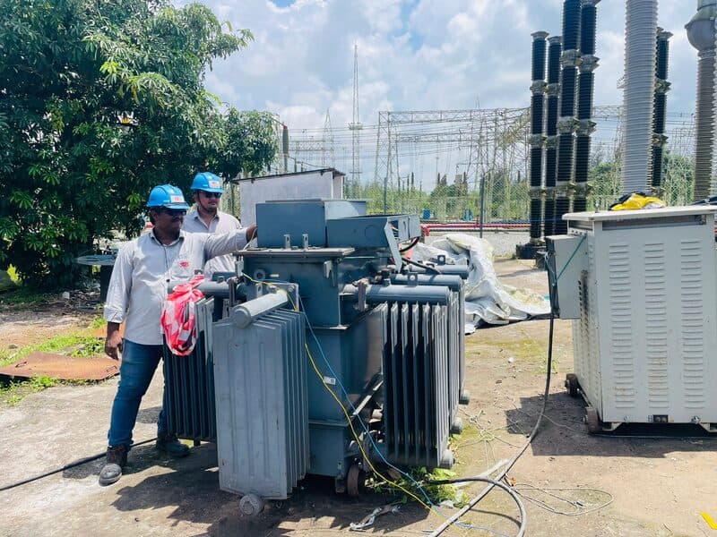 SDES engineers conducting on-site testing near a power transformer