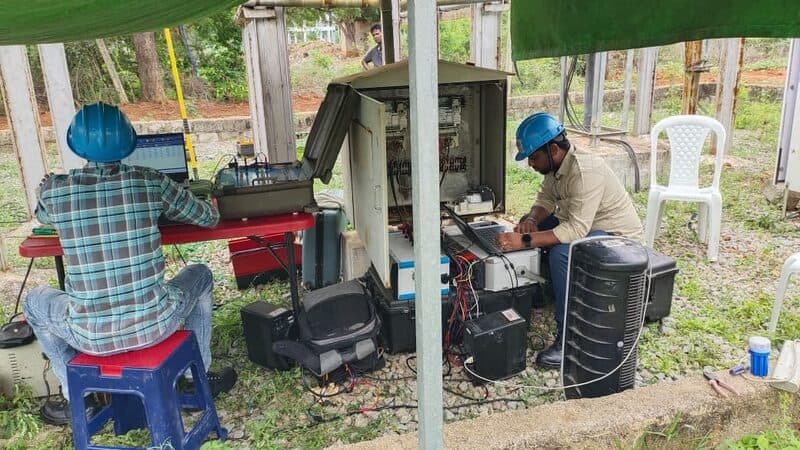 SDES engineers calibrating NET meters at a solar power plant site